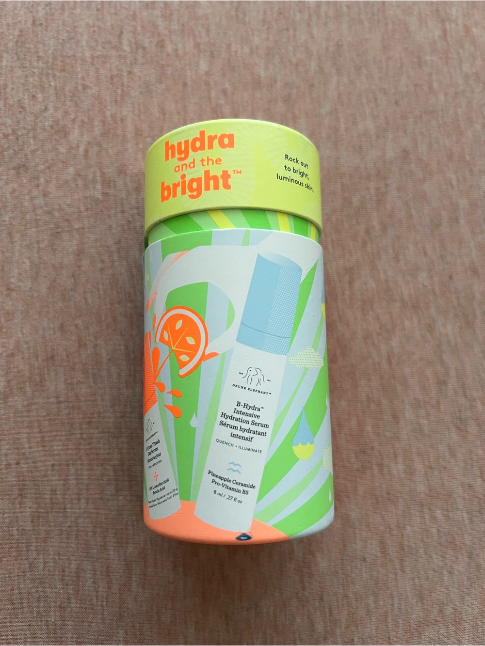 Drunk Elephant Hydrating Serum Tube — Lime Green with Orange Accents